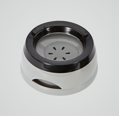 Round white and black plastic pet water bowl with a non-slip base on a gray background