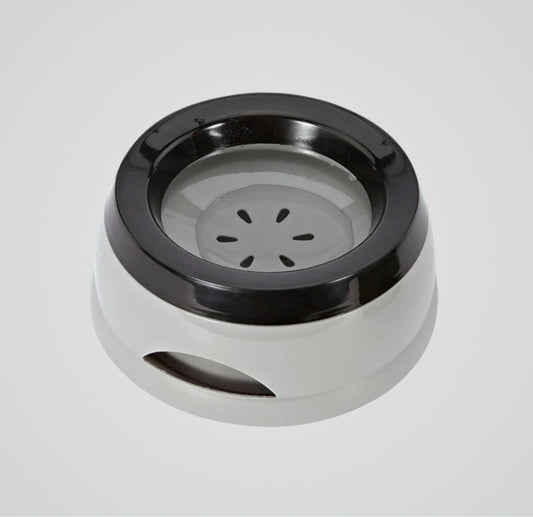 Round white and black plastic pet water bowl with a non-slip base on a gray background