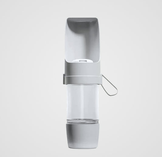 Portable gray and white pet water bottle with attached drinking bowl and silicone strap