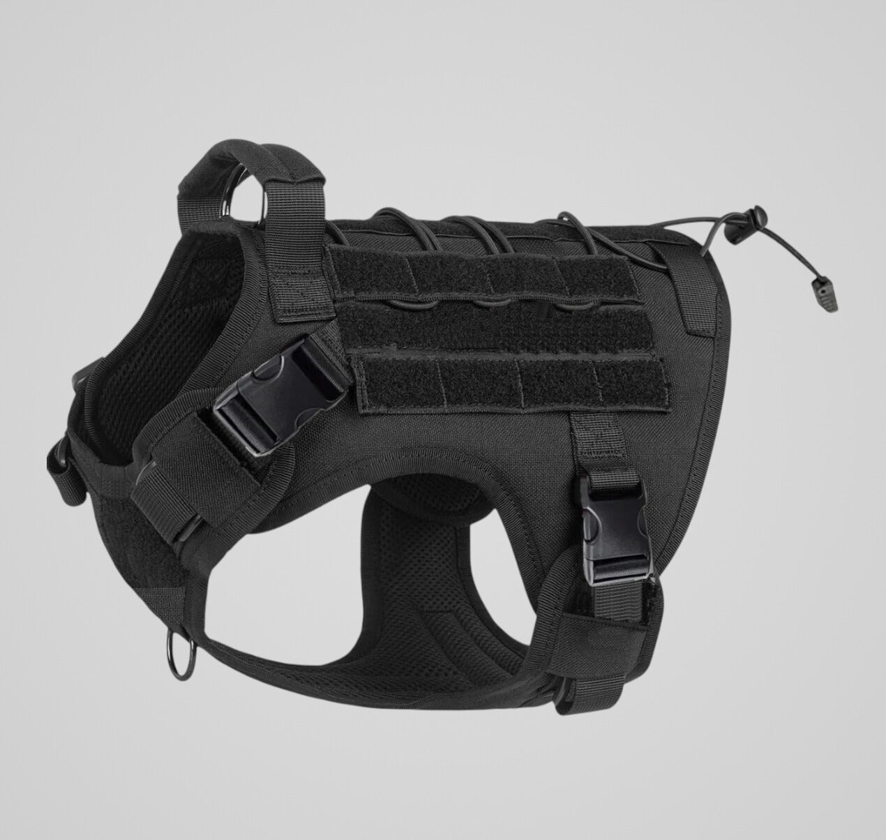 Black tactical dog harness with adjustable straps, buckle closures, padded interior, and velcro panels